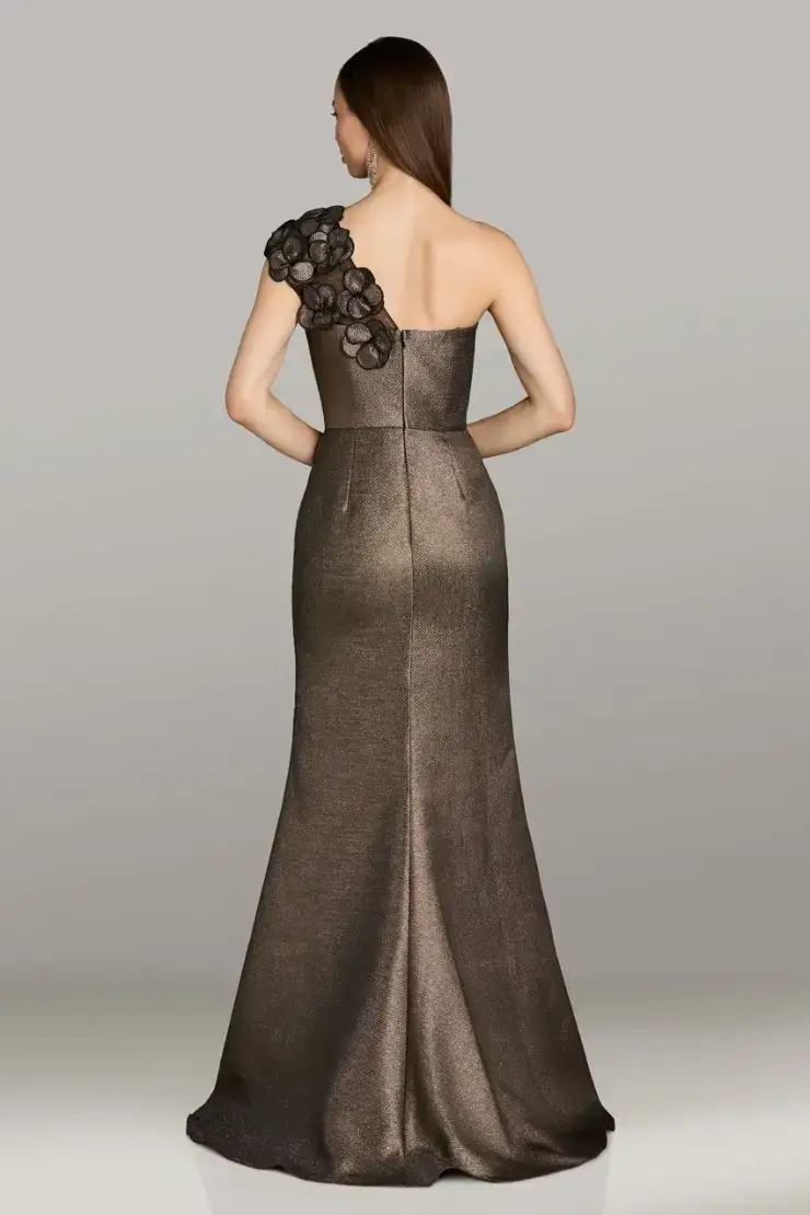 model is wearing a one shoulder brown fit and flare mother of the bride dress