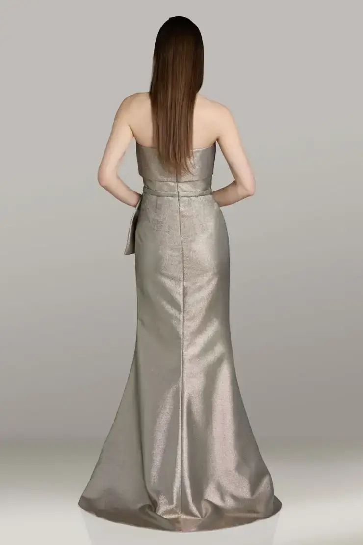 model is wearing a strapless fit and flare metallic mother of the bride dress