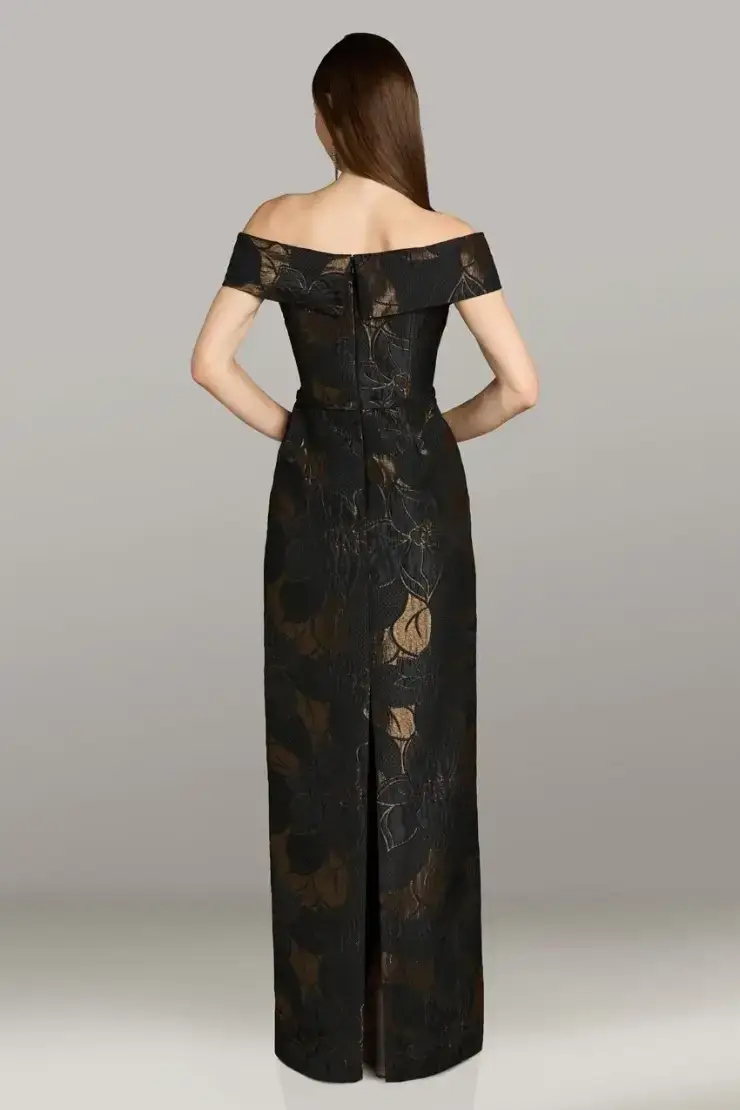 model is wearing a black sheath off the shoulder mother of the bride dress