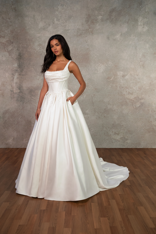 model is wearing a ball gown with no sleeves